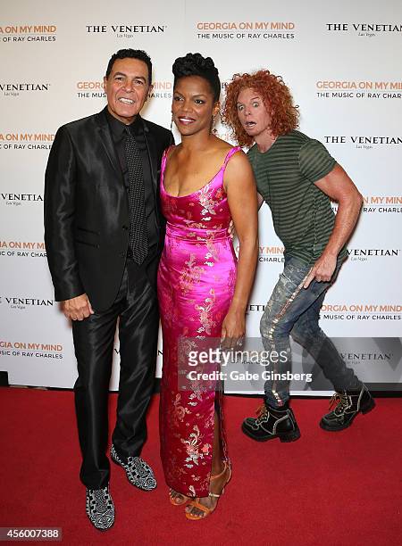Comedian Carrot Top walks behind singers Clint Holmes and Nnenna Freelon as they arrives at "Georgia On My Mind: Celebrating The Music Of Ray...