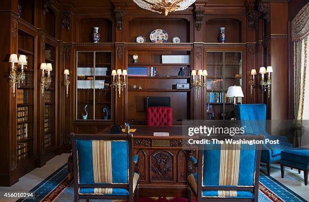 Frank Islam's wood paneled library with a Resolute desk, a replica of the one that President John F. Kennedy, Jr. Used in the Oval Office of the...