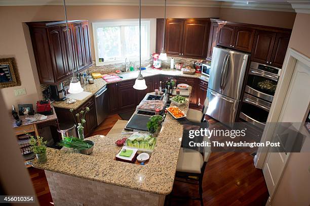 View of the kitchen in the home of Greta De Keyser and Bart Vandaele's in Alexandria, Virginia on September 06, 2014.