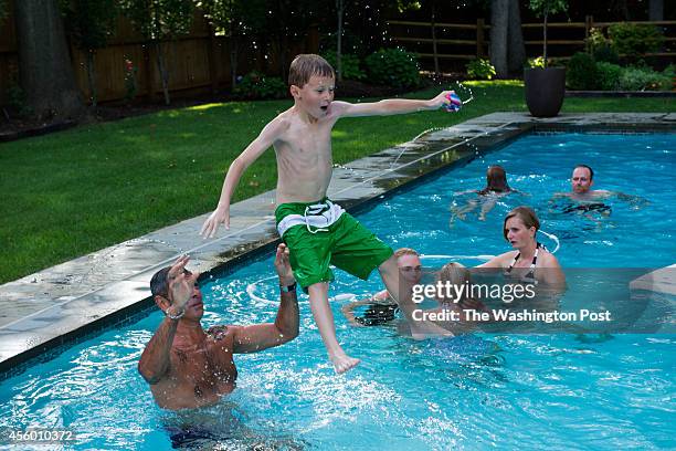 Guests enjoyed playing in the pool at the home of Greta De Keyser and Bart Vandaele's home in Alexandria, Virginia on September 06, 2014.