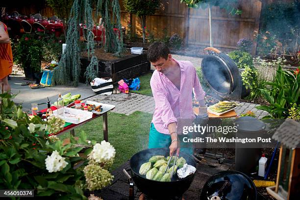 Chef Bart Vandaele preparing dinner for guest at his home in Alexandria, Virginia on September 06, 2014.