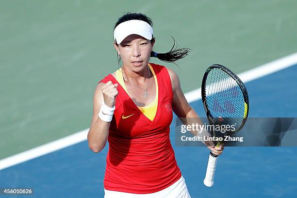 Zheng Jie of China celebrates a point during the Women's Team Gold Medal Match against Hsieh Su Wei of Chinese Taibei on day five of the 2014 Asian...