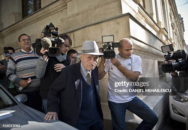 Alexandru Visinescu exits from the Court after he attended his trial in Bucharest on September 24, 2014. The former chief of a notoriously brutal...