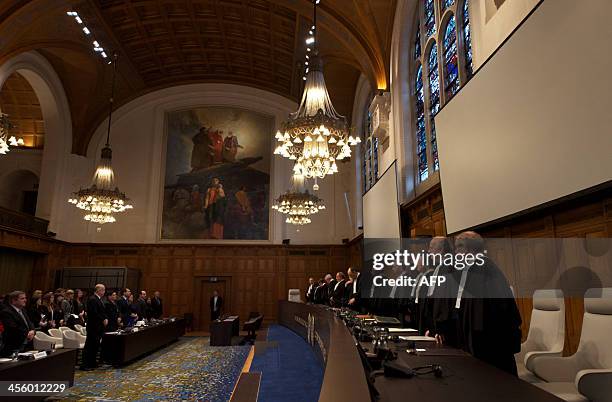 International Court of Justice judges preside over the verdict hearing in The Hague on December 13, 2013 on provisional measures over an island...