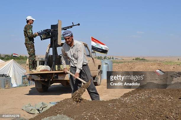 Shi'ite Turkmen militias mount guard against possible Islamic State of Iraq and Levant attacks in Tuz Khurmatu district of Kirkuk, Iraq, on September...