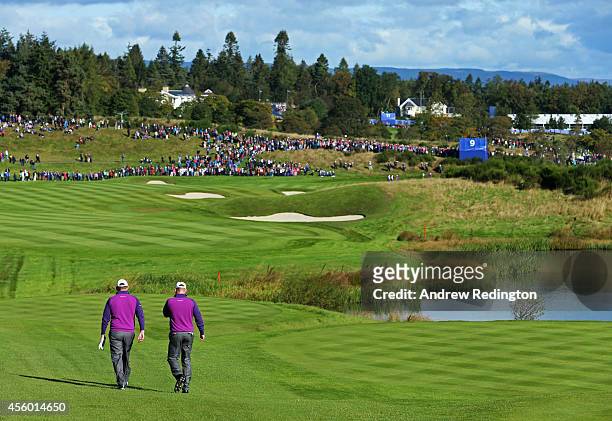 Stephen Gallacher and Jamie Donaldson of Europe walk on the 9th hole during practice ahead of the 2014 Ryder Cup on the PGA Centenary course at the...