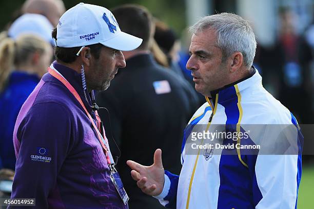 Europe team captain Paul McGinley talks with vice captain Jose Maria Olazabal during practice ahead of the 2014 Ryder Cup on the PGA Centenary course...
