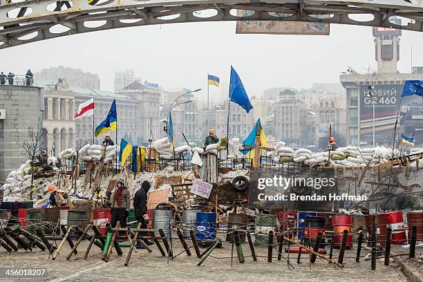 Anti-government protesters continue to fortify their barricades intended to block the police from forcing them out of Independence Square on December...