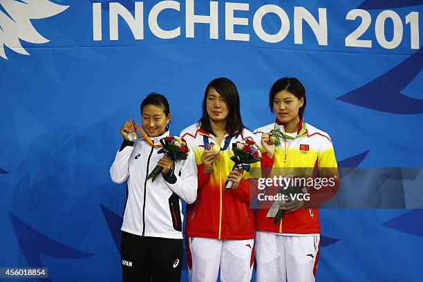 Shen Duo wins gold medal, Tang Yi wins silver medal in final of women's 200 m freestyle during day five of the 2014 Asian Games at on September 24,...