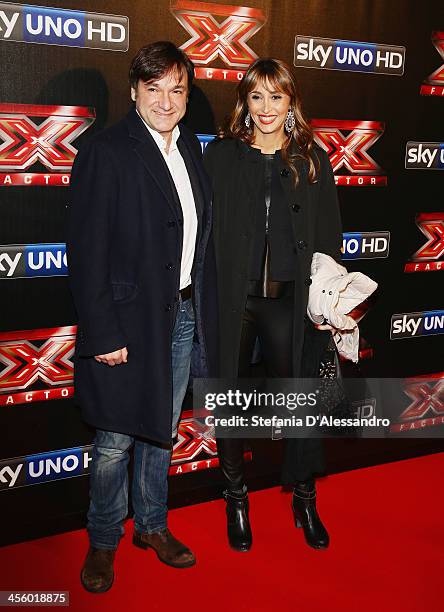 Fabio Caressa and Benedetta Parodi attend "X Factor 2013 - The Final" Red Carpet on December 12, 2013 in Milan, Italy.