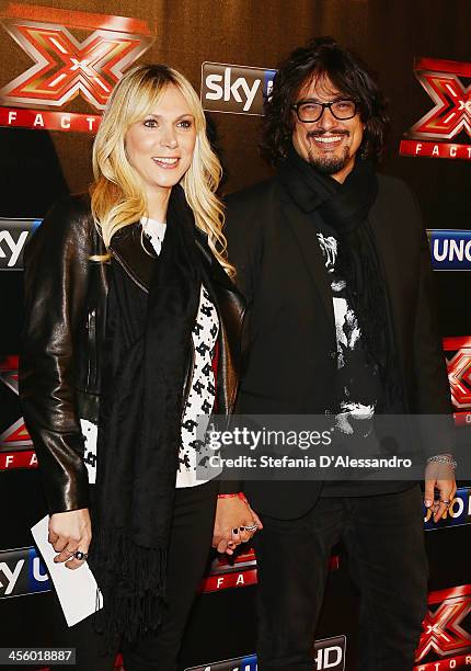 Wilma Oliviero and Alessandro Borghese attend "X Factor 2013 - The Final" Red Carpet on December 12, 2013 in Milan, Italy.