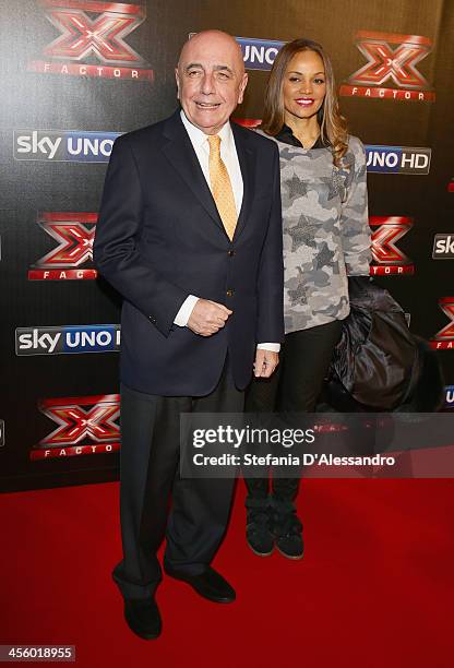 Adriano Galliani and Helga Costa attend "X Factor 2013 - The Final" Red Carpet on December 12, 2013 in Milan, Italy.