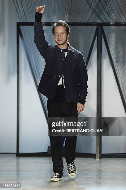 Croatian fashion designer Damir Doma acknowleges the public during the 2015 Spring/Summer ready-to-wear collection fashion show, on September 24,...
