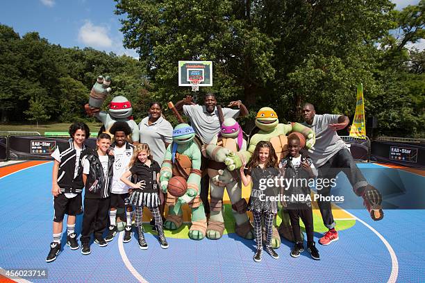 Young fans participate with Kym Hampton, Larry Johnson, Felipe Lopez during the Nickelodeon Worldwide Day of Play Basketball Clinic on September 20,...