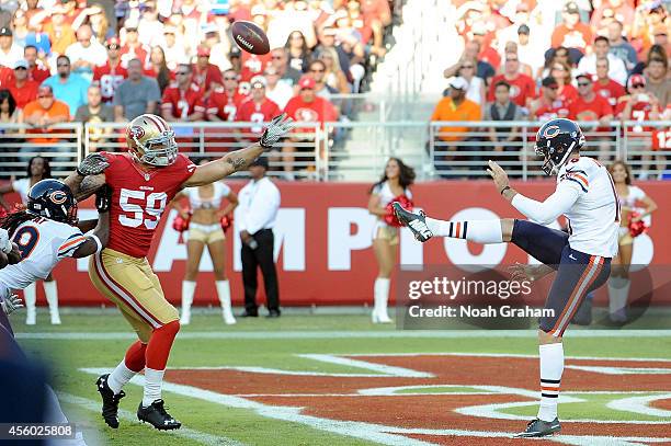 Linebacker Aaron Lynch of the San Francisco 49ers blocks punter Pat O'Donnell of the Chicago Bears during their game at Levi's Stadium on September...