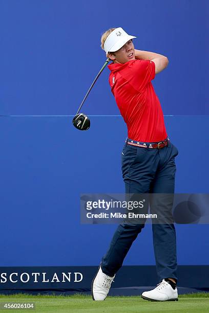 Sam Burns of Team USA hits a tee shot during the Friendship Match ahead of the 2014 Ryder Cup on the PGA Centenary course at the Gleneagles Hotel on...