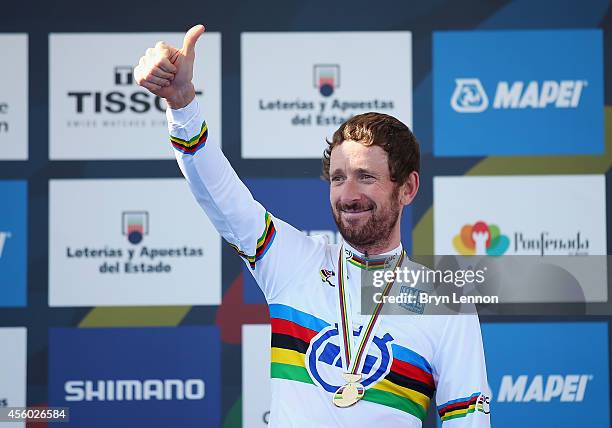 Sir Bradley Wiggins of Great Britain stands on the podium after winning the Elite Men's Individual Time Trial on day four of the UCI Road World...