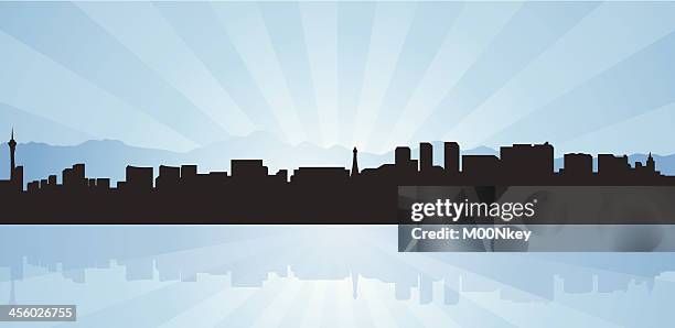 a silhouette of the skyline of las vegas on blue background - the mirage las vegas stock illustrations