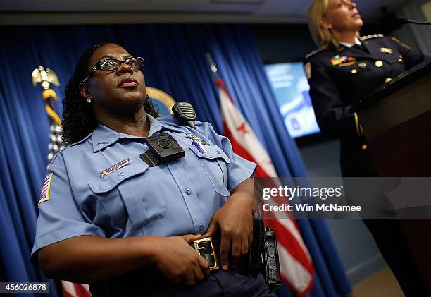 Washington DC Metropolitan Police Officers Debra Domino wears one of the new "body-worn cameras" that the city's officers will begin using during a...