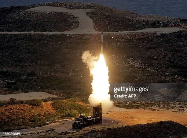 An S-300 PMU-1 anti-aircraft missile launches during a Greek army military exercise near Chania on the island of Crete on December 13, 2013. Greece...