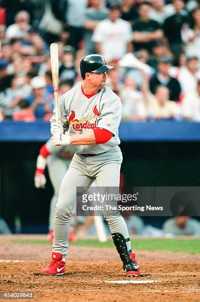 Mark McGwire of the St. Louis Cardinals bats during Game Three of the National League Championship Series against the New York Mets on October 14,...