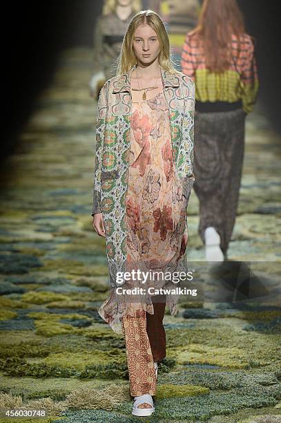 Model walks the runway at the Dries Van Noten Spring Summer 2015 fashion show during Paris Fashion Week on September 24, 2014 in Paris, France.