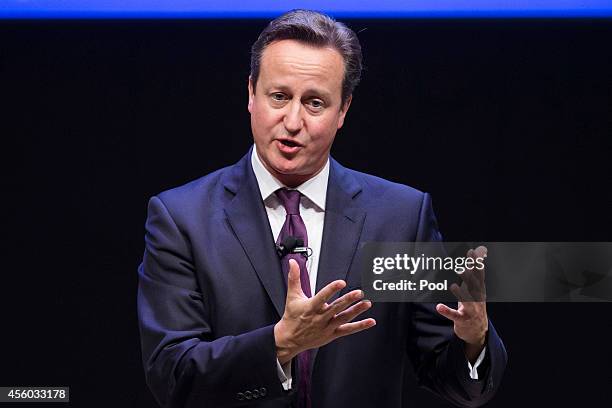 British Prime Minister David Cameron speaks during a high-level meeting at the Ford Foundation on post-2015 anti-poverty goals, on September 24 in...