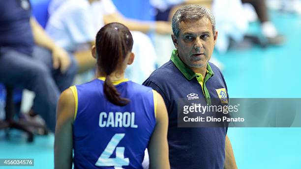 Head coach of Brazil Jose Roberto Lages Guimareas speaks with Ana Carolina Da Silva during the FIVB Women's World Championship pool B match between...