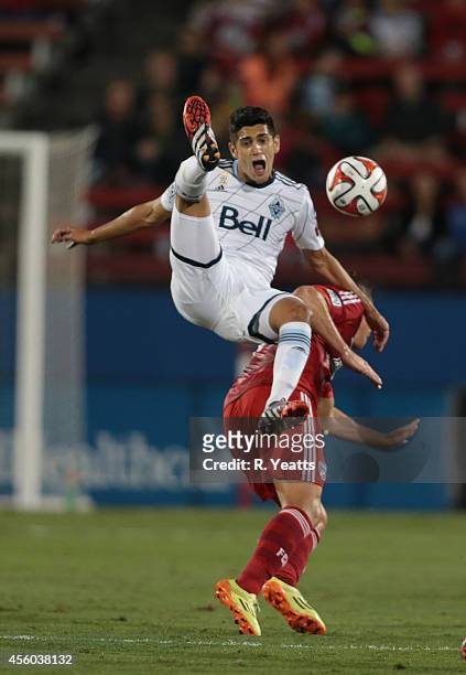 Sebastian Fernandez of Vancouver FC defends the ball from Michel of FC Dallas at Toyota Stadium in Frisco on September 14, 2014 in Frisco Texas.