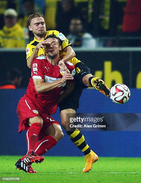 Christian Gentner of Stuttgart is challenged by Marcel Schmelzer of Dortmund during the Bundesliga match between Borussia Dortmund and VfB Stuttgart...