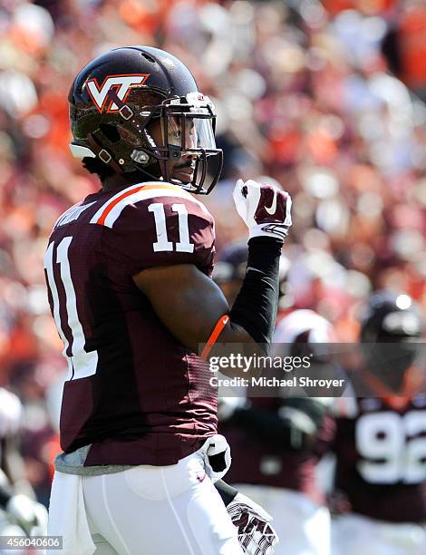 Cornerback Kendall Fuller of the Virginia Tech Hokies reacts after a defensive play against the Georgia Tech Yellow Jackets in the first half at Lane...