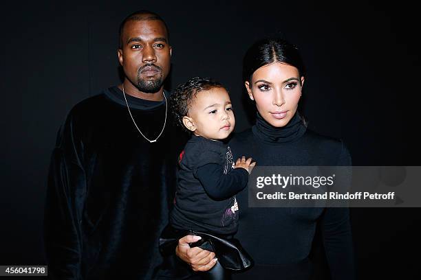 Kanye West, Kim Kardashian and their daughter North West attend the Balenciaga show as part of the Paris Fashion Week Womenswear Spring/Summer 2015...