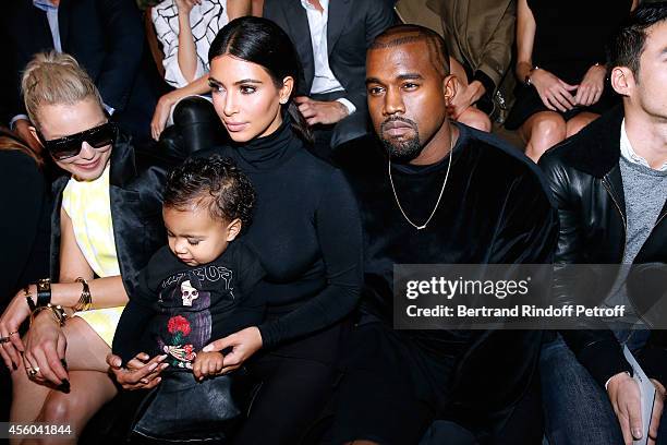 Kanye West, Kim Kardashian and their daughter North West attend the Balenciaga show as part of the Paris Fashion Week Womenswear Spring/Summer 2015...