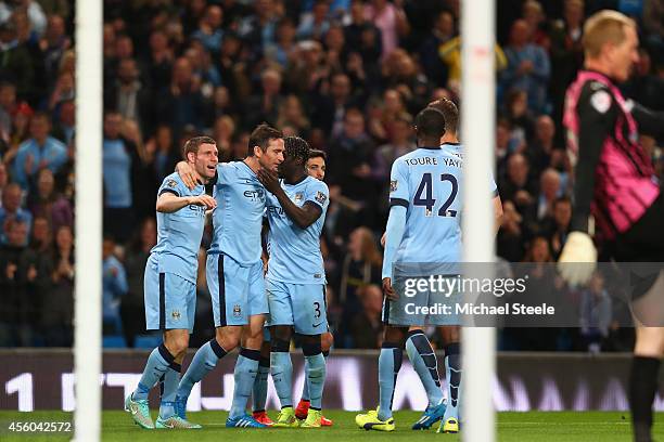 Frank Lampard of Manchester City celebrates scoring the opening goal with James Milner and Bacary Sagna ( during the Capital One Cup Third Round...