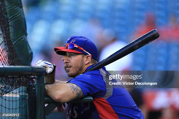 Arencibia of the Texas Rangers waits for his turn in the batting cage during batting practice prior the MLB game against the Los Angeles Angels of...