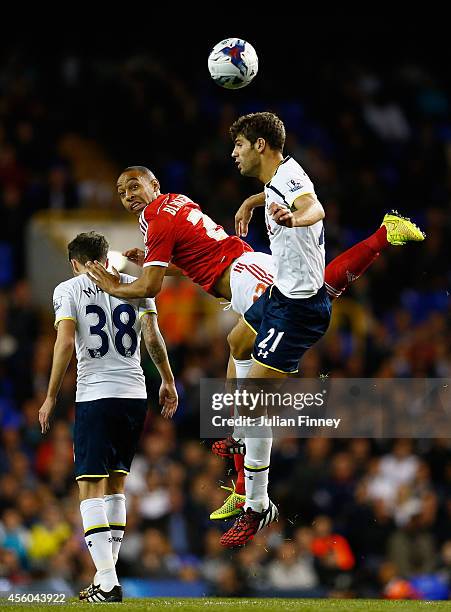 Federico Fazio of Tottenham Hotspur battles with Dexter Blackstock of Nottingham Forest during the Capital One Cup third round match between...