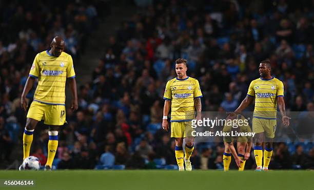 The players of Sheffield Wednesday look dejected after conceding a goal during the Capital One Cup Third Round match between Manchester City and...