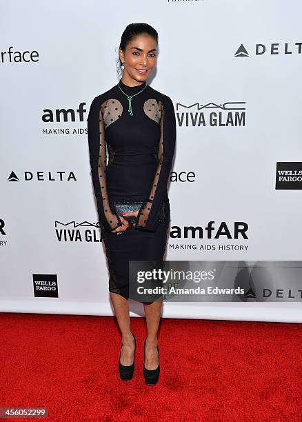 Natalie John arrives at amfAR The Foundation for AIDS 4th Annual Inspiration Gala at Milk Studios on December 12, 2013 in Hollywood, California.