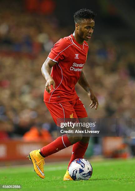 Raheem Sterling of Liverpool runs with the ball during the Capital One Cup Third Round match between Liverpool and Middlesbrough at Anfield on...