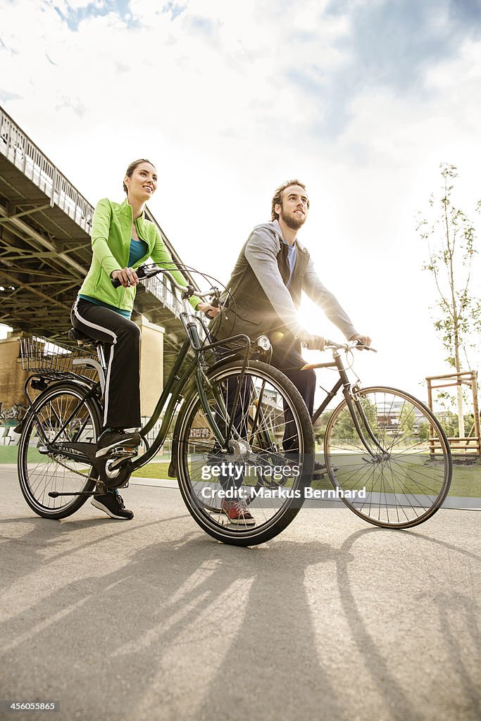 Couple enjoying ride with their bicycles.