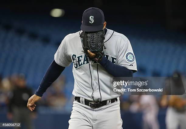 Taijuan Walker of the Seattle Mariners reacts after getting the last out of the eighth inning during MLB game action against the Toronto Blue Jays on...