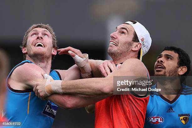 Ben McEvoy and Jonathon Ceglar, both pressing for the ruck position, compete for the ball during a Hawthorn Hawks AFL training session at Waverley...