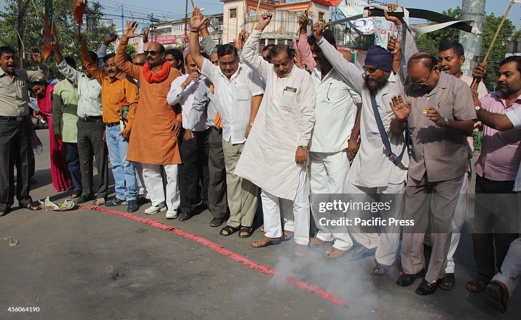 BJP workers celebrate  the successful insertion of  "...