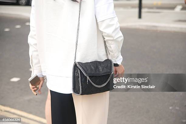 Guest wears a Stella McCartney bag on day 5 of London Collections: Women on September 16, 2014 in London, England.