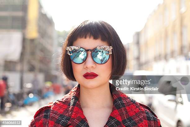 Eyewear Designer Moo Piyasombatkul is wearing designerâs own sunglasses, Simone Rocha jacket on day 5 of London Collections: Women on September 16,...