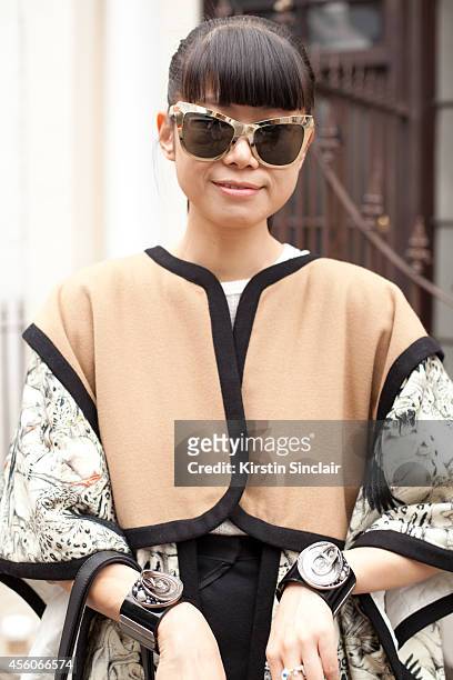 Fashion Stylist Leaf Greener is wearing a Swash London cape, Reve by Rene sunglasses, Chanel cuffs on day 5 of London Collections: Women on September...