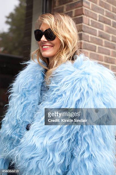 Fashion Stylist Tess Yopp is wearing Linda Farrow sunglasses and a Marques Almeida coat on day 5 of London Collections: Women on September 16, 2014...