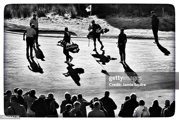 United States team members walk on the 9th green during practice ahead of the 2014 Ryder Cup on the PGA Centenary course at the Gleneagles Hotel on...