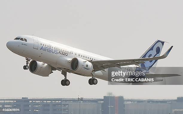 Airbus A320neo takes off for its first test flight, on September 25, 2014 in Blagnac near Toulouse. The first outing by the A320neo the revamped and...