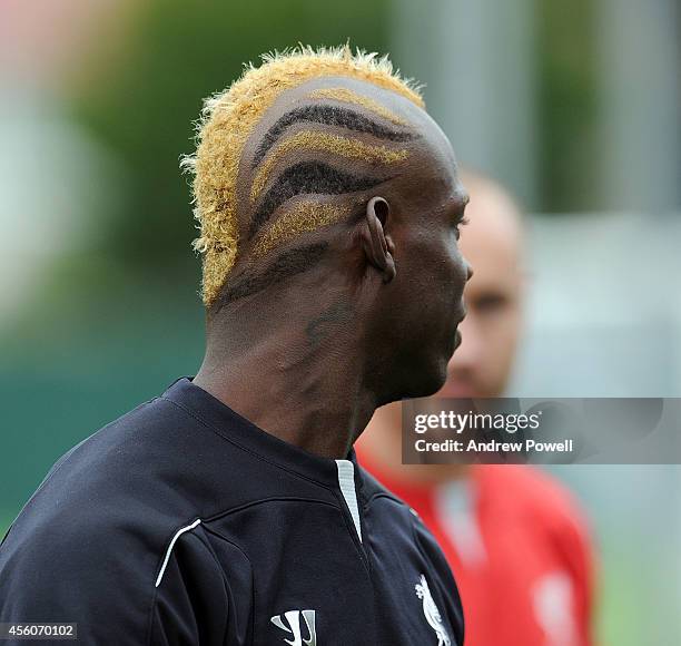 Mario Balotelli of Liverpool sports a new hair-cut during a training... News Photo - Getty Images Mario Balotelli of Liverpool sports a new hair-cut during a training... News Photo - Getty Images